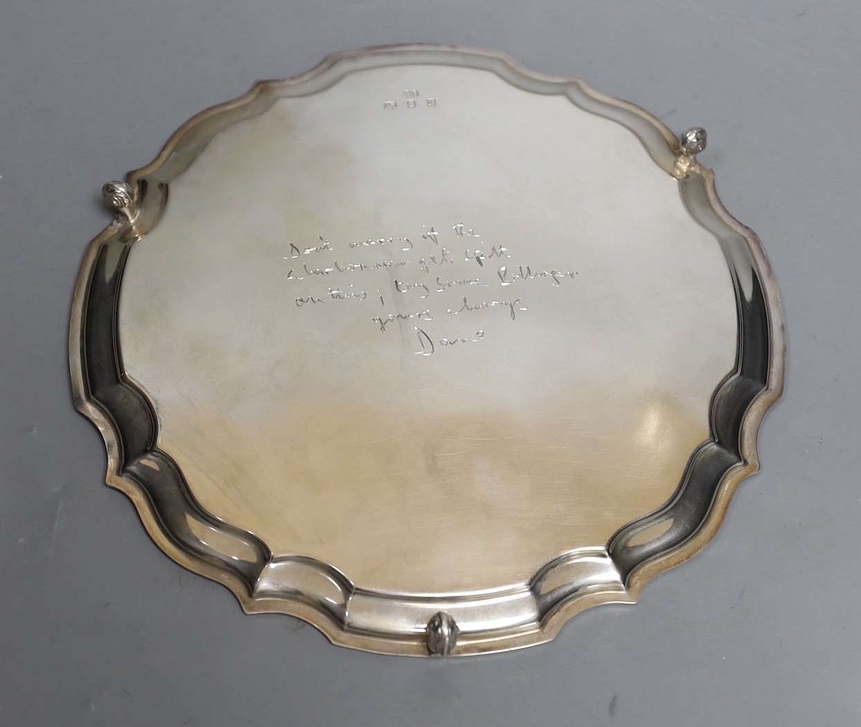 A modern silver salver with scroll feet and inscription verso, maker, HB, London, 1972, 25.3cm, 14.9oz.
